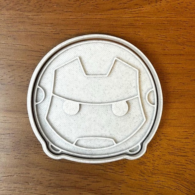 Close-up of a 3D-printed cookie cutter showing its sealed cutting edge and raised stamp detail - Stamp and Bake